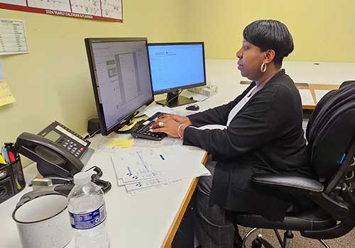 Renee Ruffin at her desk